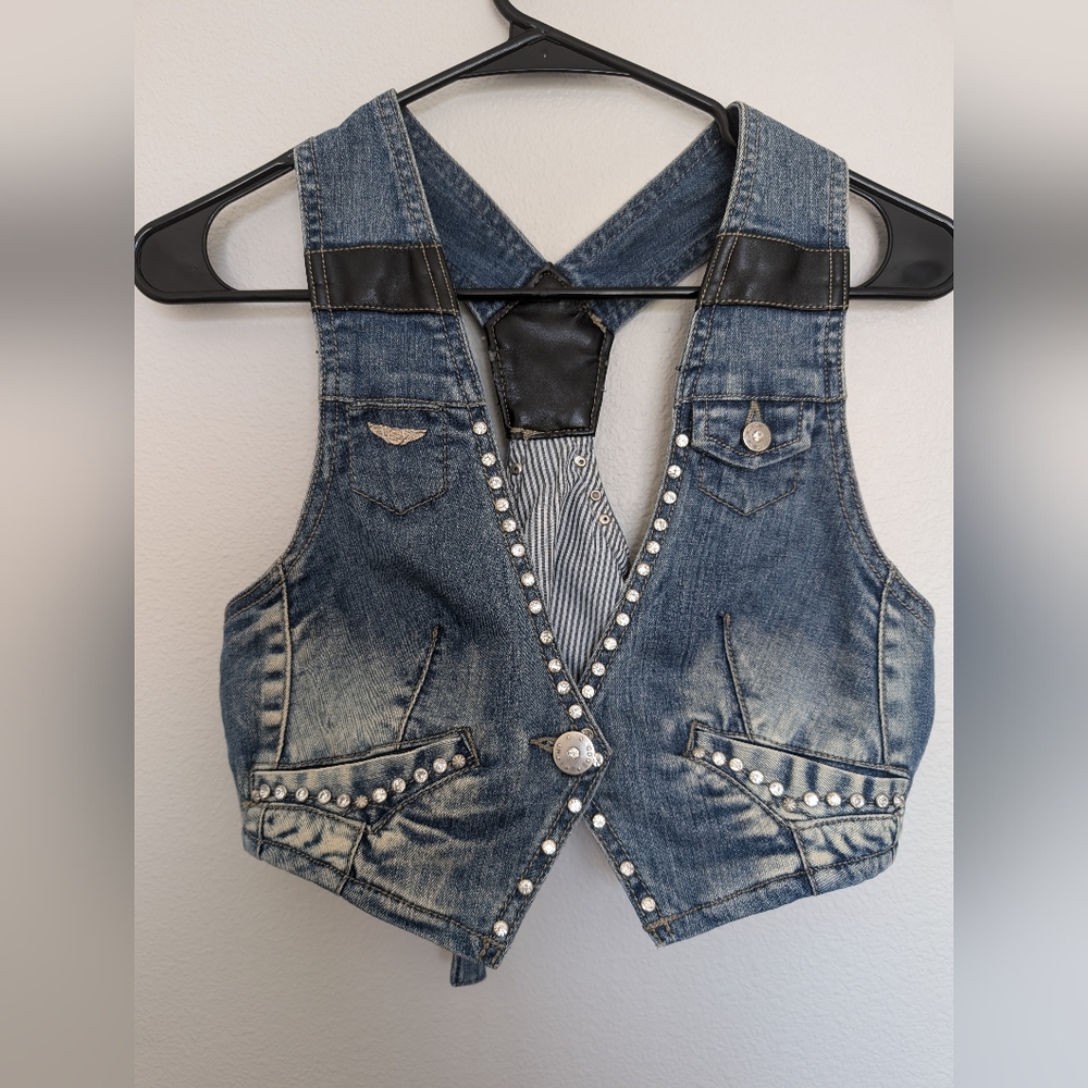 2009 - Denim cropped aviator vest, with pleather accents & bling embelishements.